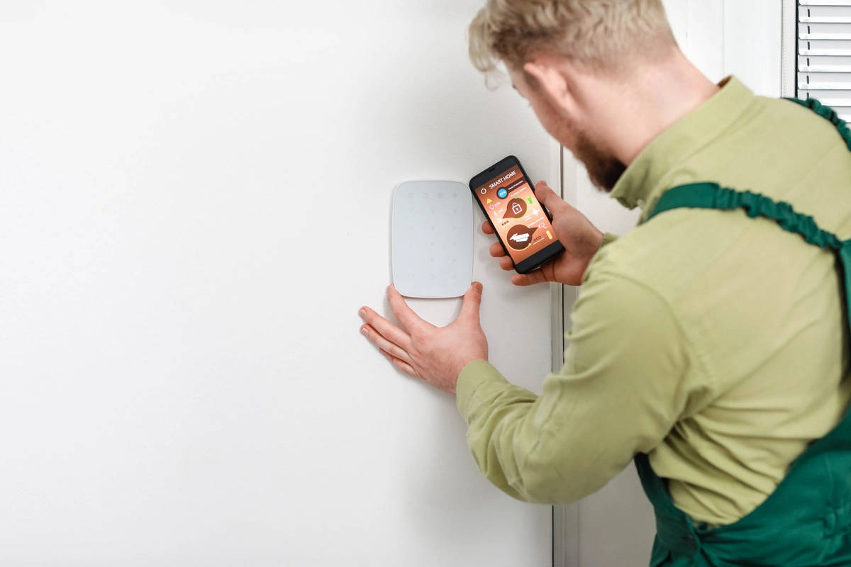 A guy installing smart home device